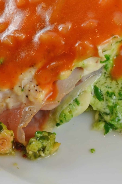 Gruyere and Prosciutto Stuffed Chicken is topped off with a silky tomato and shallot sauce. While this looks like a restaurant caliber meal, it only takes about 1 hour!