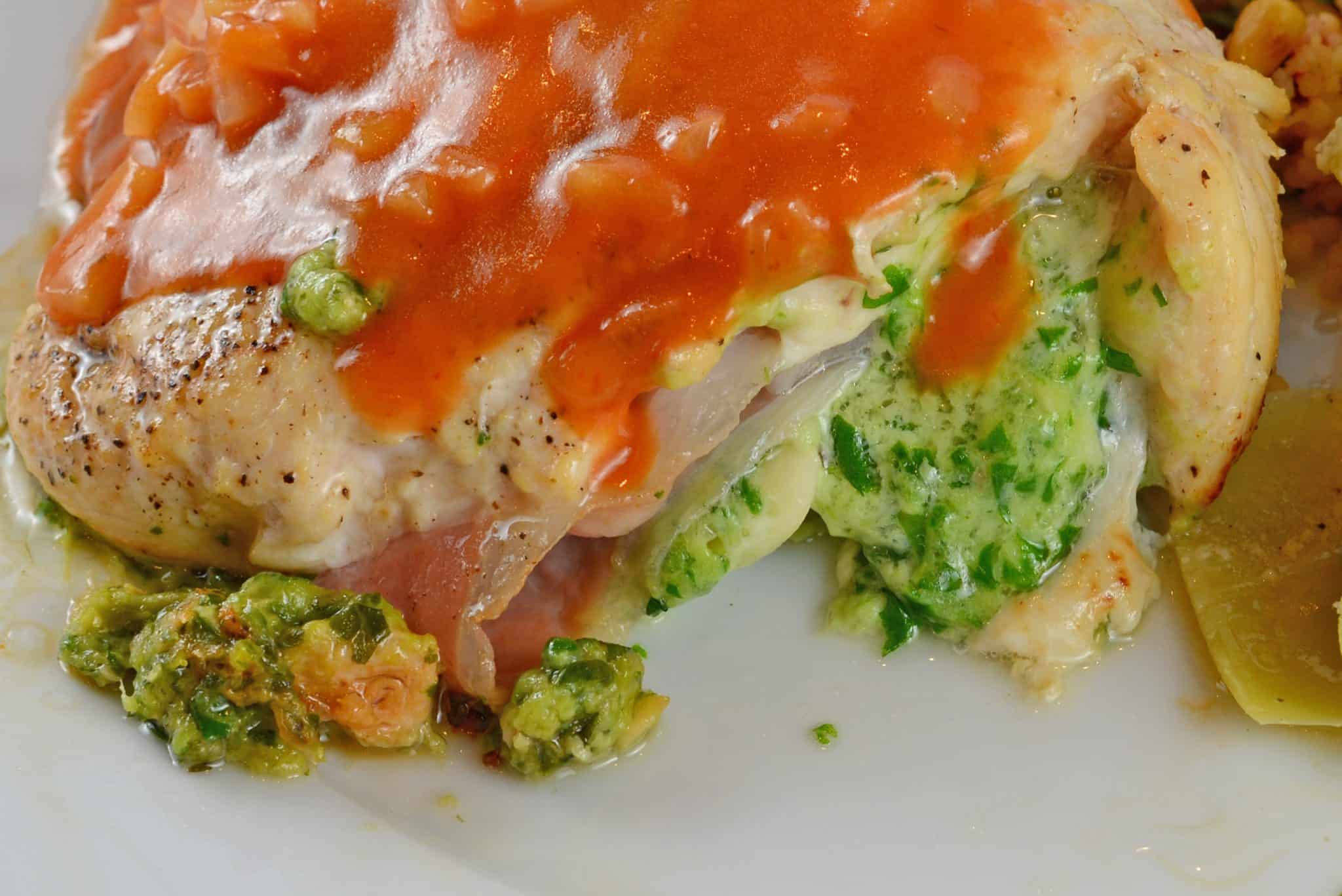 Gruyere and Prosciutto Stuffed Chicken is topped off with a silky tomato and shallot sauce. While this looks like a restaurant caliber meal, it only takes about 1 hour!