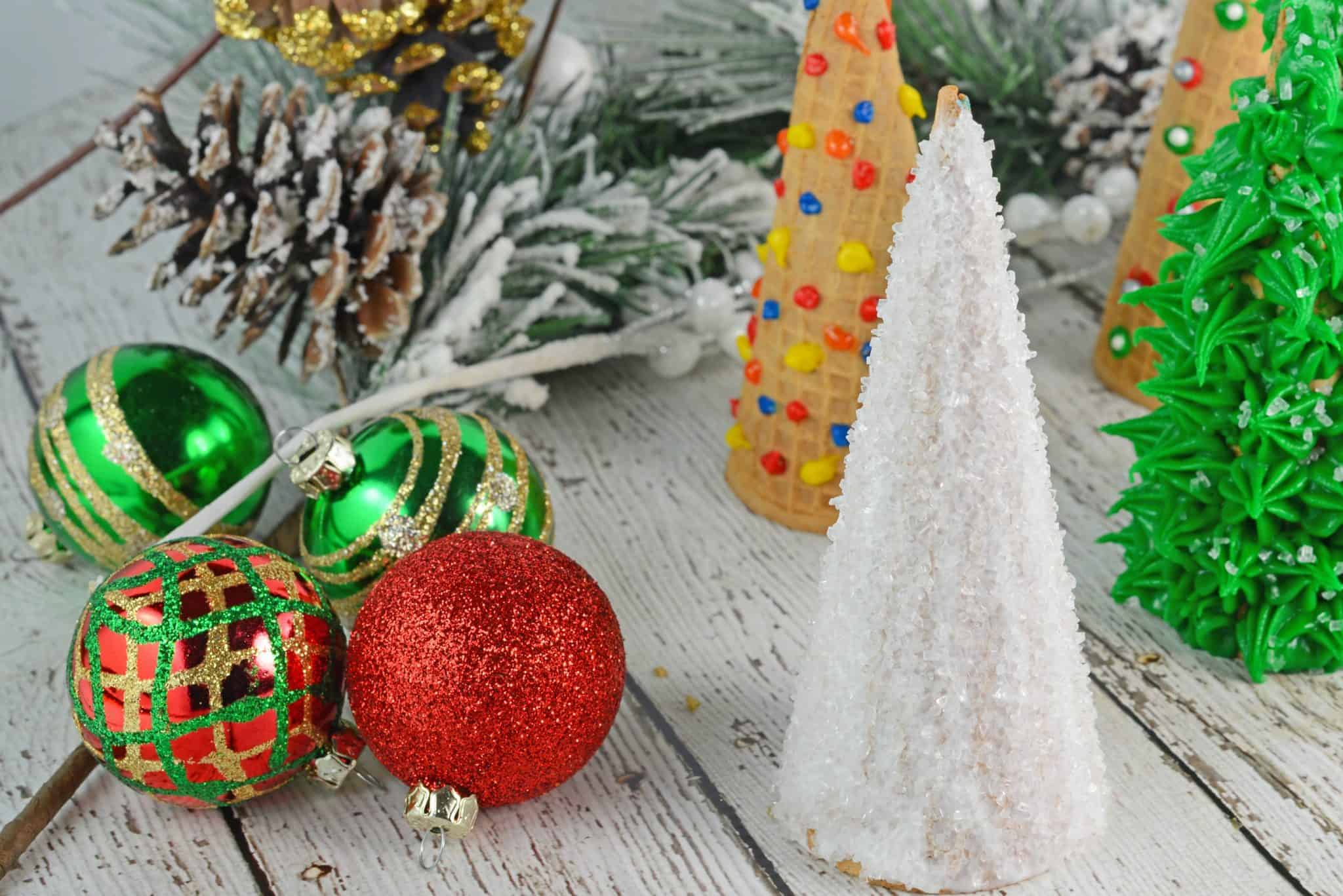 Christmas Tree Cake Cones are filled with cake and frosting and then festively decorated and a fun holiday activity for kids.