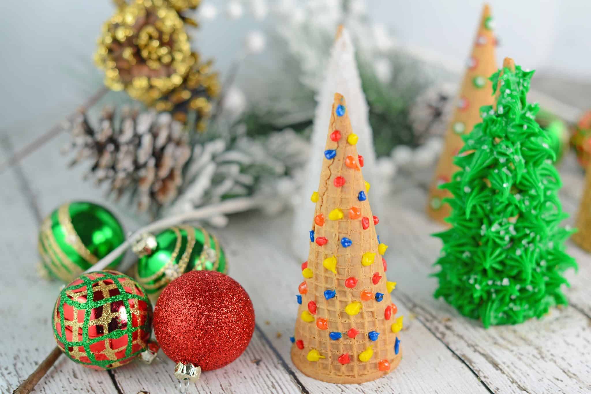 Christmas Tree Cake Cones are filled with cake and frosting and then festively decorated and a fun holiday activity for kids.