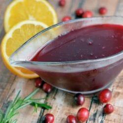 Ruby Red Cranberry Syrup is a tartly sweet flavored syrup that will wake up your taste buds! Serve for breakfast or dessert! #cranberrysyrup #homemadesyrup #flavoredsyrup www.savoryexperiments.com