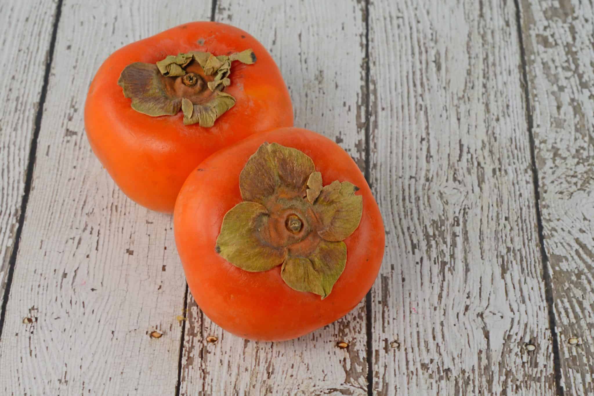 A Persimmon Tart is an easy dessert or breakfast recipe using bright orange persimmon, brown sugar and buttery puff pastry.