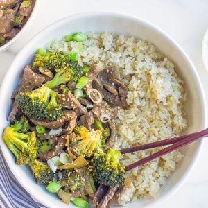 overhead bowl of beef and broccoli with chopsticks