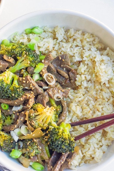 overhead bowl of beef and broccoli with chopsticks