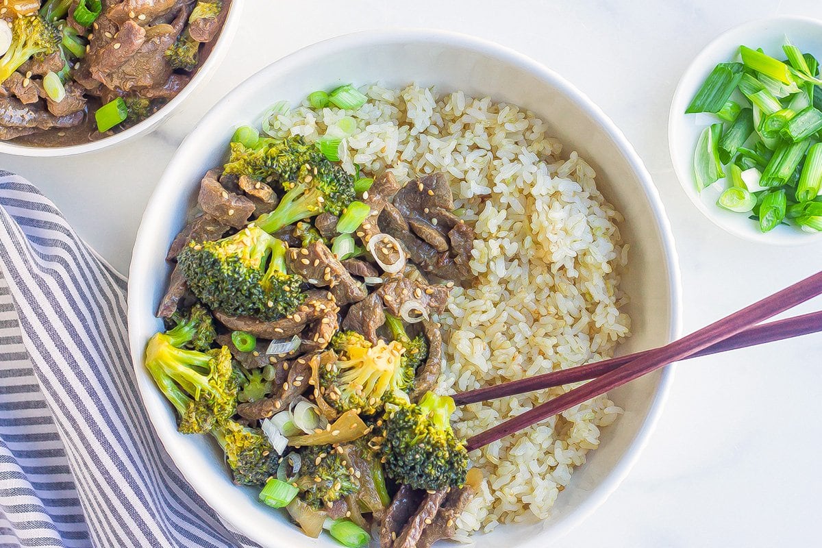 overhead bowl of beef and broccoli with chopsticks