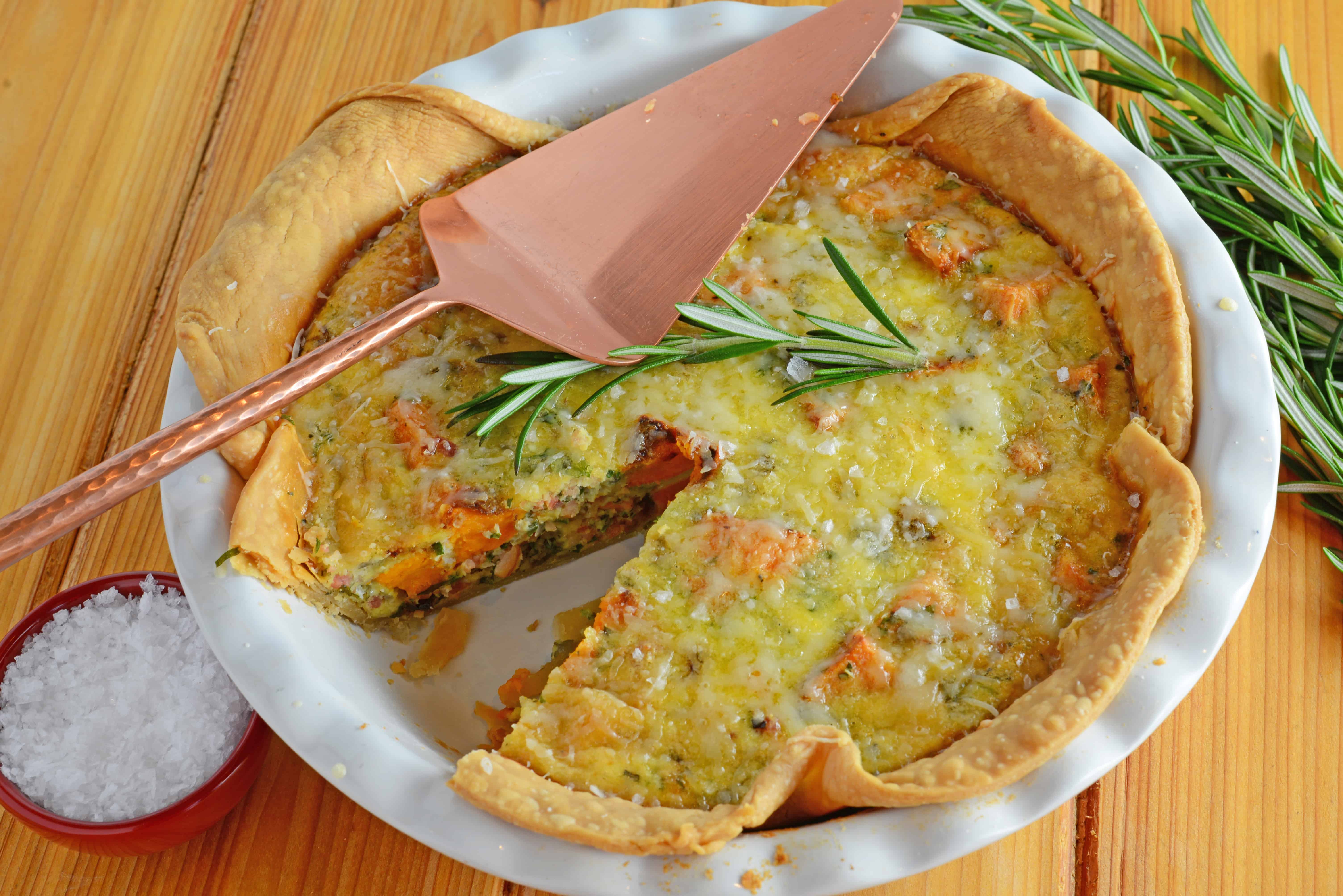 Sweet Potato Quiche can be made as a brunch, entree or side dish. Roasted sweet potatoes, red onion, bacon and rosemary make this a winning quiche recipe!