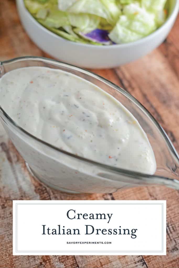 gravy boat of creamy italian dressing on a wood background 