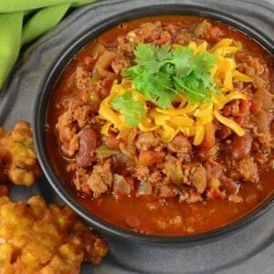 Easy Chili is a spicy mix full of ground beef, Italian sausage and vegetables, but there is a secret ingredient that makes it different from every other chili out there!