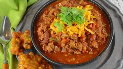 Easy Chili is a spicy mix full of ground beef, Italian sausage and vegetables, but there is a secret ingredient that makes it different from every other chili out there!