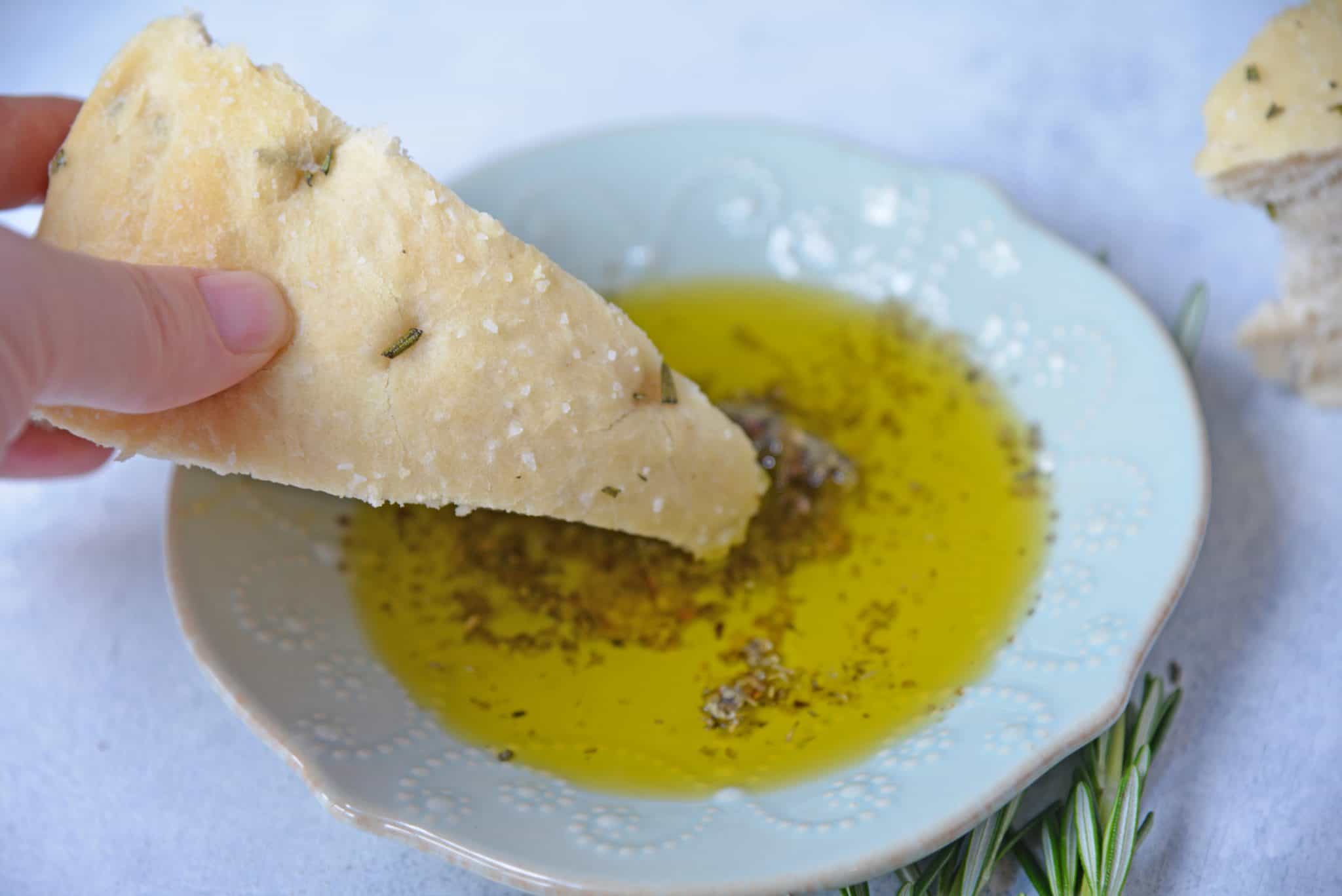 Rosemary Focaccia Bread is a recipe you can be proud of! Pair with homemade butter or olive oil bread dip for the best appetizer.  #focacciabread #easybreadrecipes www.savoryexperiments.com