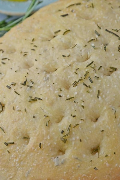 Rosemary Focaccia Bread is a recipe you can be proud of! Pair with homemade butter or olive oil bread dip for the best appetizer. #focacciabread #easybreadrecipes www.savoryexperiments.com