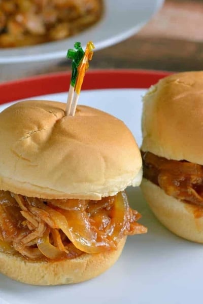 Slow Cooker Pineapple Pulled Pork Recipe- pineapple, pork and a simple BBQ sauce takes 10 minutes to put together for a tasty and quick meal.