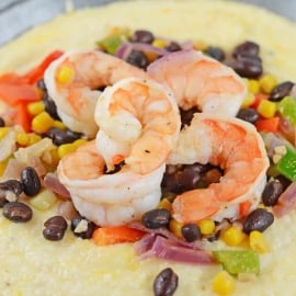 This Southwestern Shrimp and Grits recipe is a new take on an old classic! It combines Texas Caviar with Creamy Cheddar Grits and shrimp! #shrimpandgritsrecipe #cheesyshrimpandgrits www.savoryexperiments.com