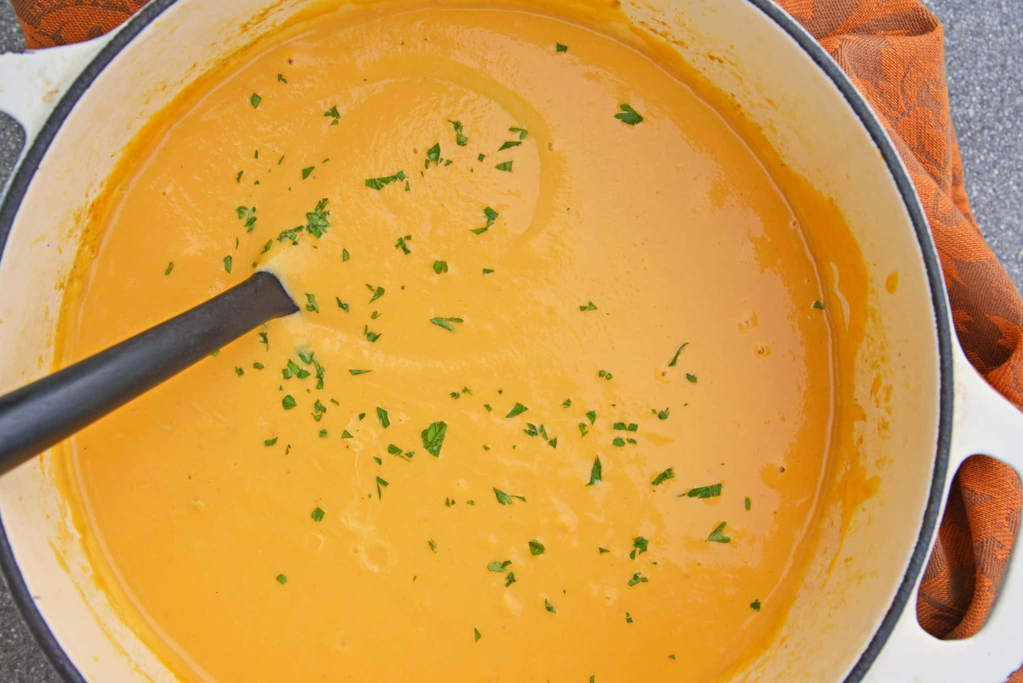 Spicy Sweet Potato Soup is a healthy blend of vegetables with a sweet and spicy kick! This soup definitely falls under the category of easy soup recipes! #sweetpotatosoup #easysouprecipes #sweetpotatorecipes www.savoryexperiments.com