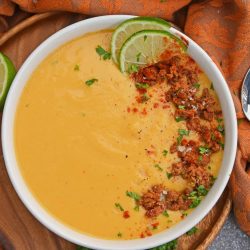 Spicy Sweet Potato Soup is a healthy blend of vegetables with a sweet and spicy kick! This soup definitely falls under the category of easy soup recipes! #sweetpotatosoup #easysouprecipes #sweetpotatorecipes www.savoryexperiments.com