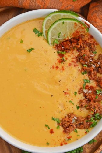 Spicy Sweet Potato Soup is a healthy blend of vegetables with a sweet and spicy kick! This soup definitely falls under the category of easy soup recipes! #sweetpotatosoup #easysouprecipes #sweetpotatorecipes www.savoryexperiments.com