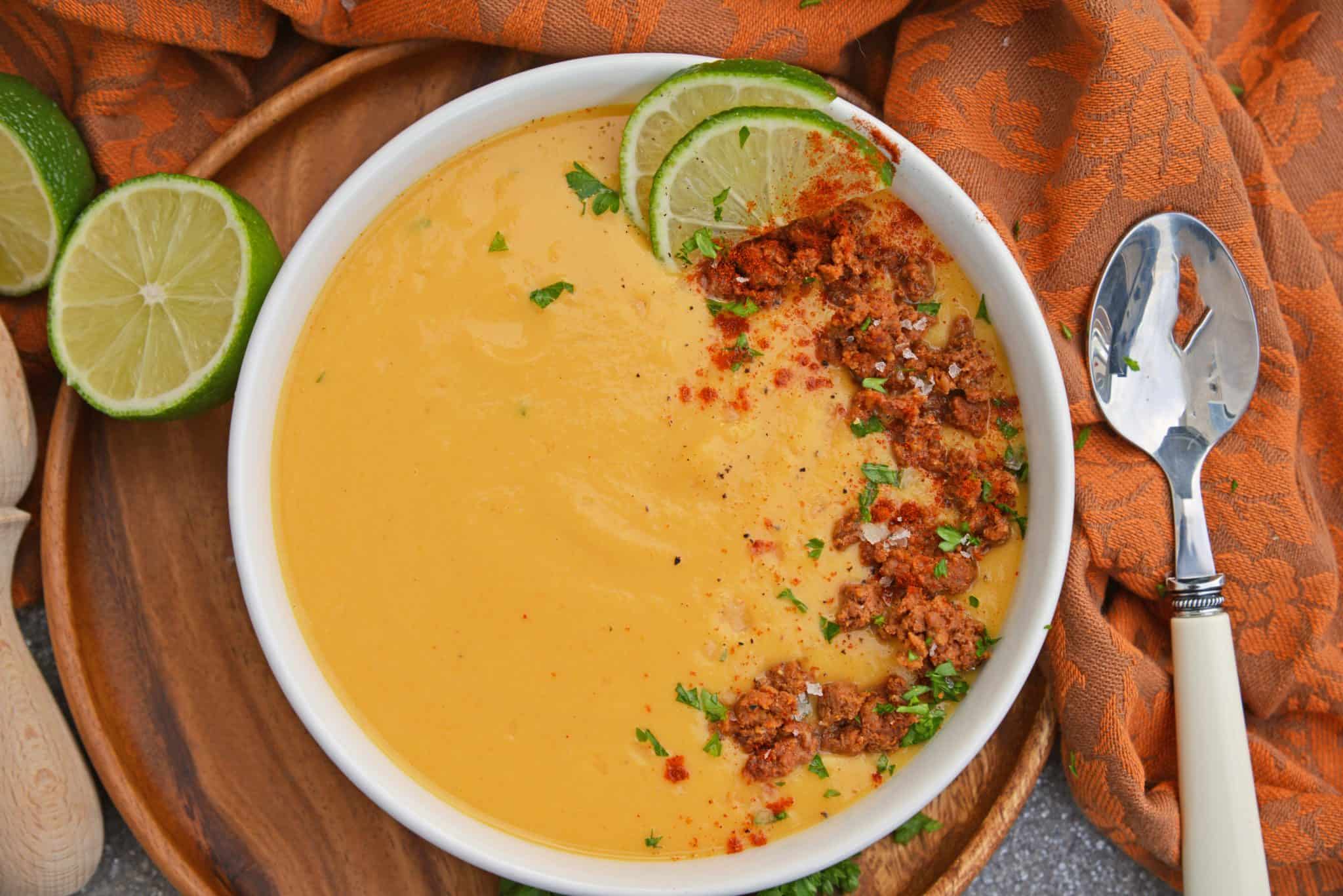 Spicy Sweet Potato Soup is a healthy blend of vegetables with a sweet and spicy kick! This soup definitely falls under the category of easy soup recipes! #sweetpotatosoup #easysouprecipes #sweetpotatorecipes www.savoryexperiments.com