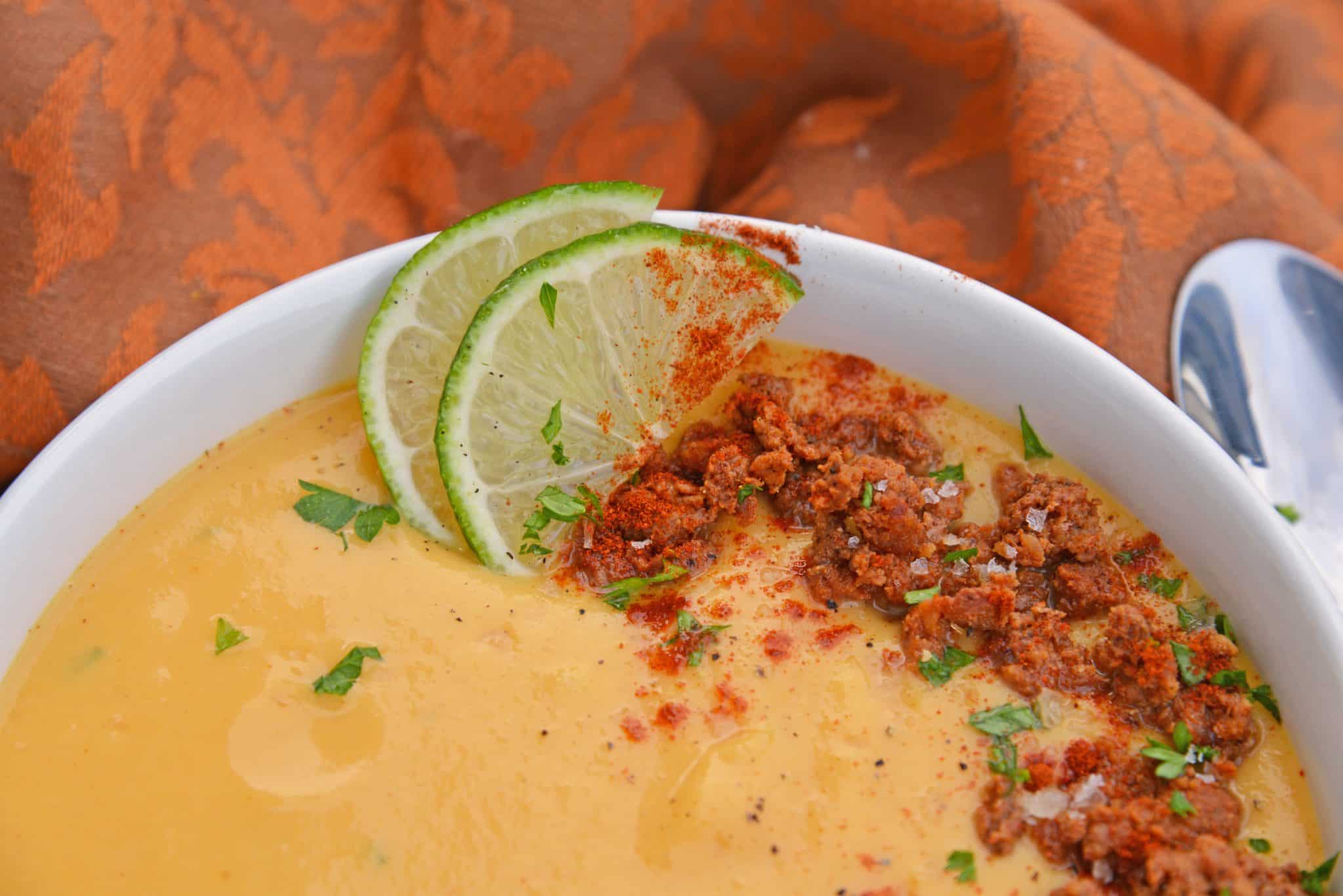 Spicy Sweet Potato Soup is a healthy blend of vegetables with a sweet and spicy kick! This soup definitely falls under the category of easy soup recipes! #sweetpotatosoup #easysouprecipes #sweetpotatorecipes www.savoryexperiments.com