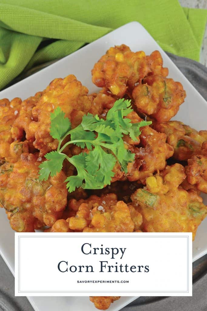 Easy Corn Fritters are lightly fried with scallions, cumin & white pepper. They're deliciously crispy! No matter how you serve these they are sure to be a hit! #easycornfritters #howtomakecornfritters #cornfrittersrecipe www.savoryexperiments.com