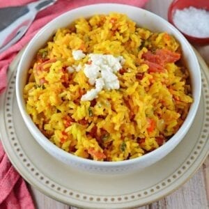 Mexican Rice is a zesty side dish recipe packed with vegetables and flavor. Serve with your favorite Mexican recipes, inside burritos or as its own dish.