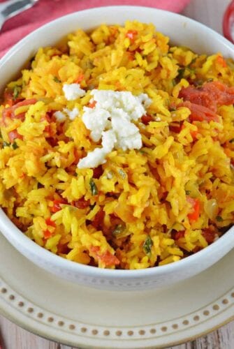 Mexican Rice is a zesty side dish recipe packed with vegetables and flavor. Serve with your favorite Mexican recipes, inside burritos or as its own dish.