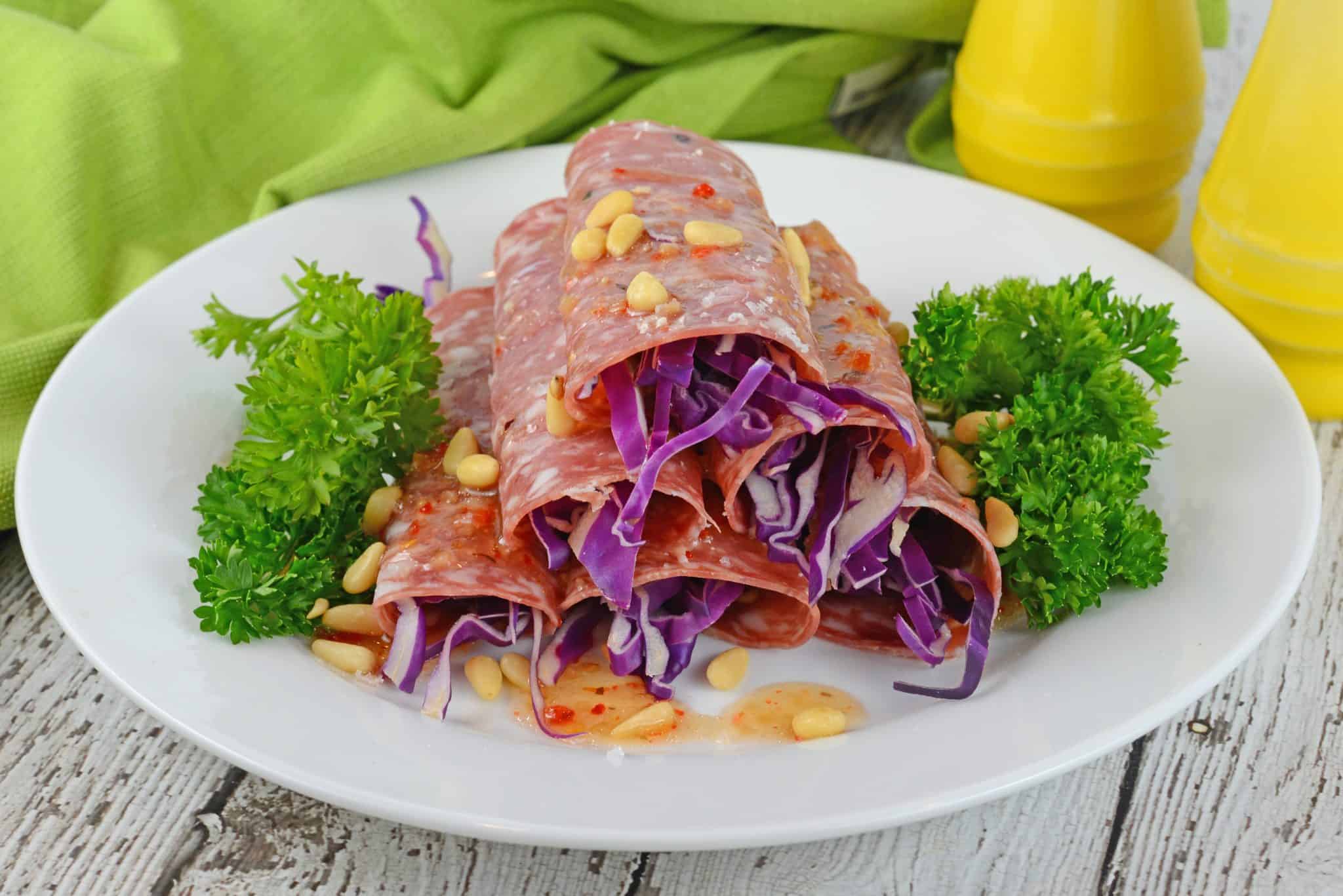 Soppressata Finger Salads are an easy, no cook appetizer filled with shredded red cabbage, pepperoncinis, goat cheese and zesty Italian dressing!