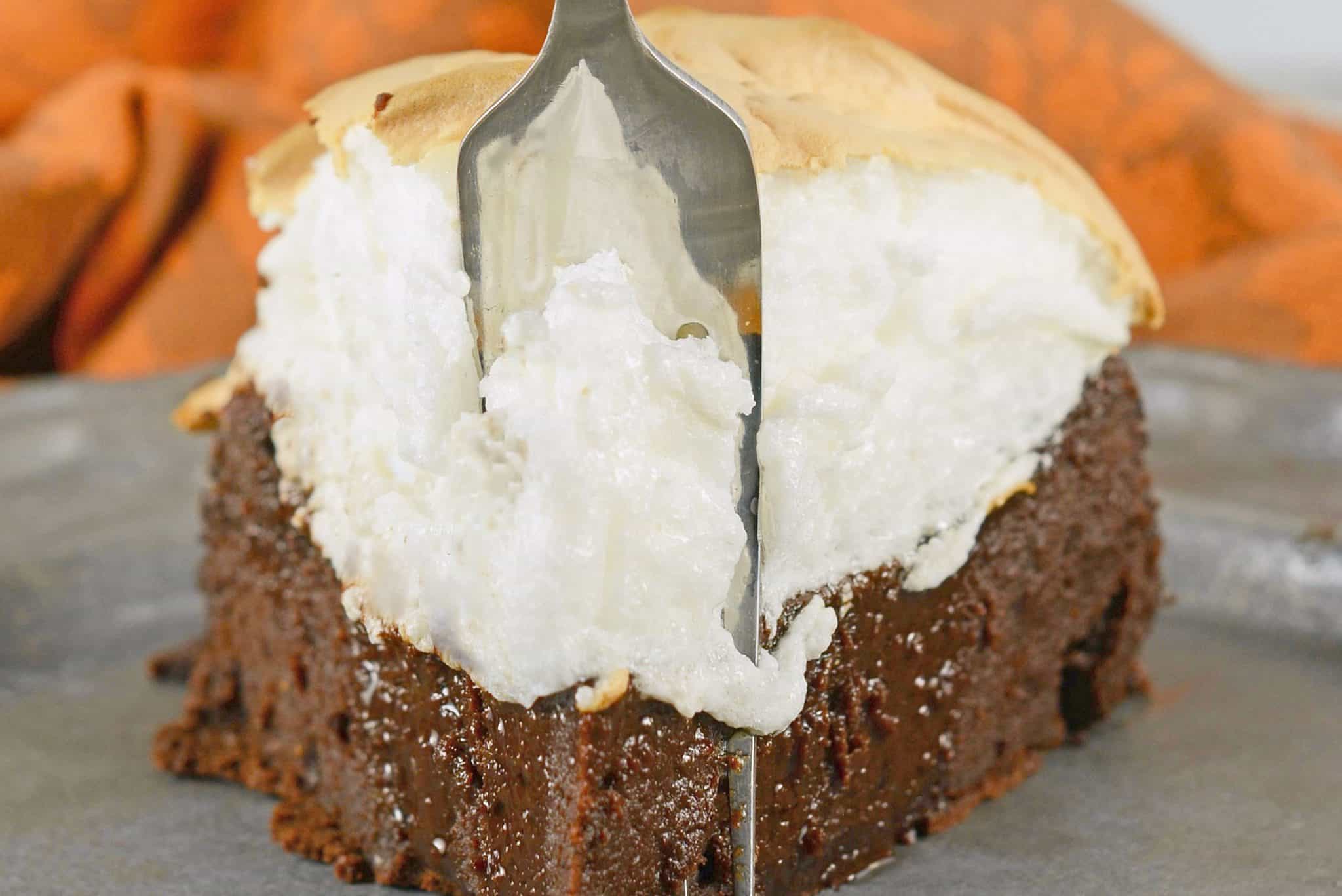 Chocolate Guinness Cake is a super rich and moist cake with fluffy meringue topping. This flourless chocolate cake is perfect for St. Patrick's Day dessert or any other day of the year! #chocolateguinnesscake #flourlesschocolatecake www.savoryexperiments.com