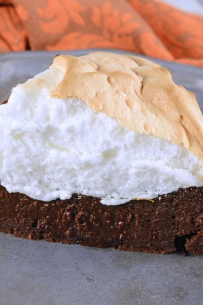Chocolate Guinness Cake is a super rich and moist cake with fluffy meringue topping. This flourless chocolate cake is perfect for St. Patrick's Day dessert or any other day of the year! #chocolateguinnesscake #flourlesschocolatecake www.savoryexperiments.com