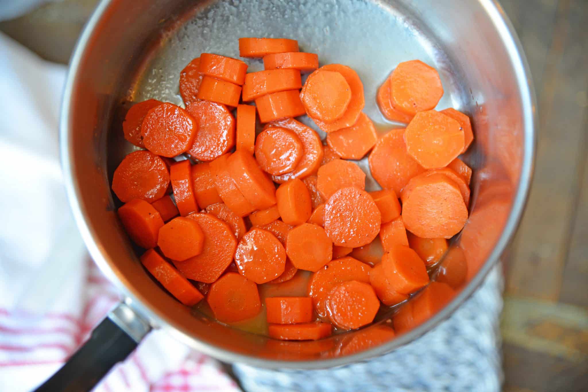 Honey Glazed Carrots are a simple dish with only a handful of ingredients that makes any family table shine! These candied carrots have a sweet & smoky flavor! #honeyglazedcarrots #candiedcarrots www.savoryexperiments.com