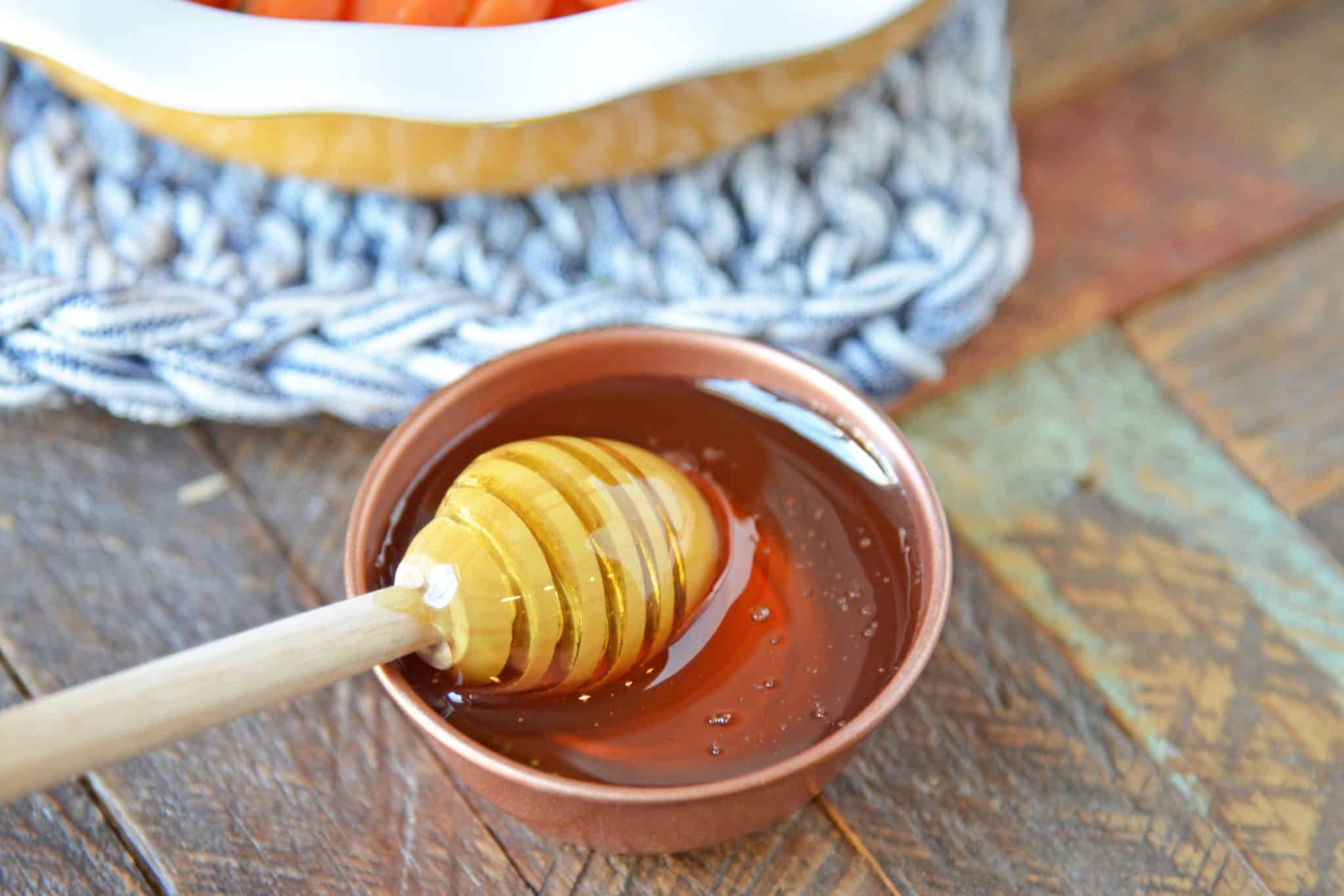 Honey Glazed Carrots are a simple dish with only a handful of ingredients that makes any family table shine! These candied carrots have a sweet & smoky flavor! #honeyglazedcarrots #candiedcarrots www.savoryexperiments.com
