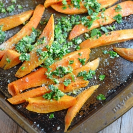 Parmesan Garlic Baked Sweet Potato Fries- take this super food up a few notches with a garlicky, Parmesan topping on top of sweet potato fries with a crispy outside with a soft and sweet inside. I eat a whole batch as a meal! www.savoryexperiments.com