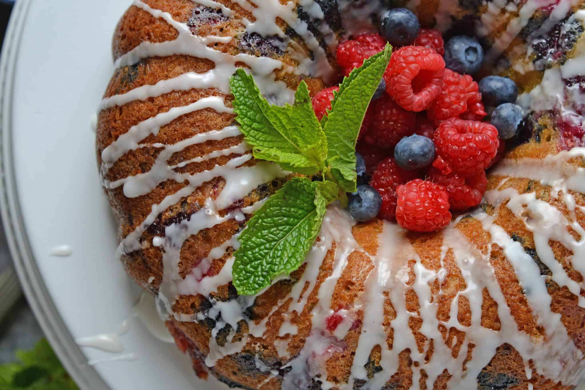 berry buttermilk bundt cake with glaze and fresh mint 