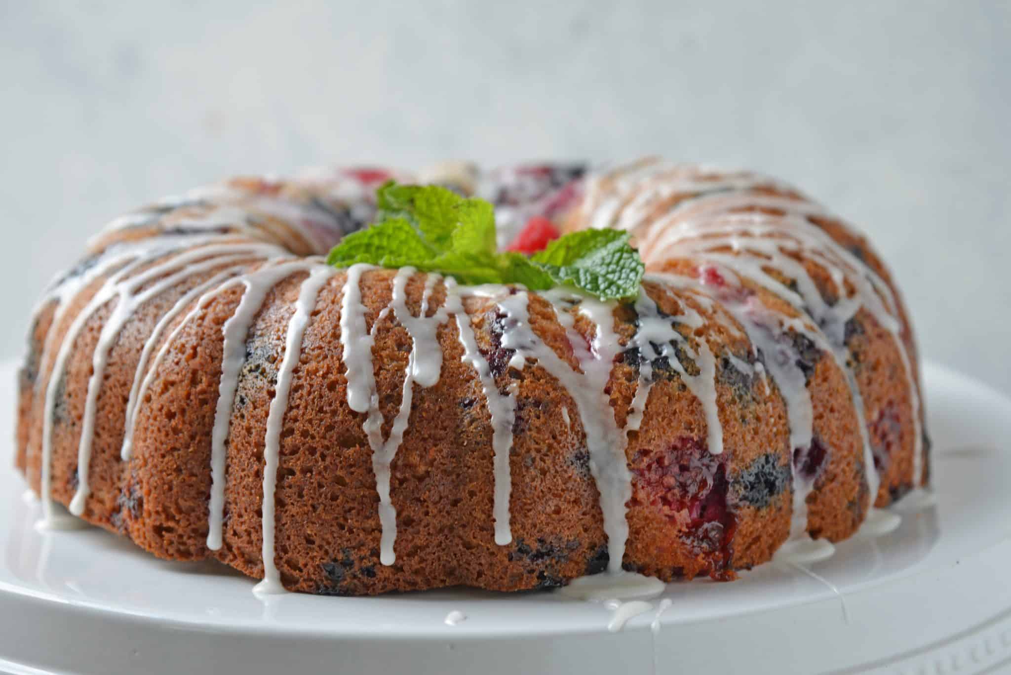 You will be making this Berry Buttermilk Pound Cake all year long! Fresh or frozen berries, this buttermilk cake is delicious and perfect for dessert or brunch. #buttermilkcake #buttermilkpoundcake www.savoryexperiments.com