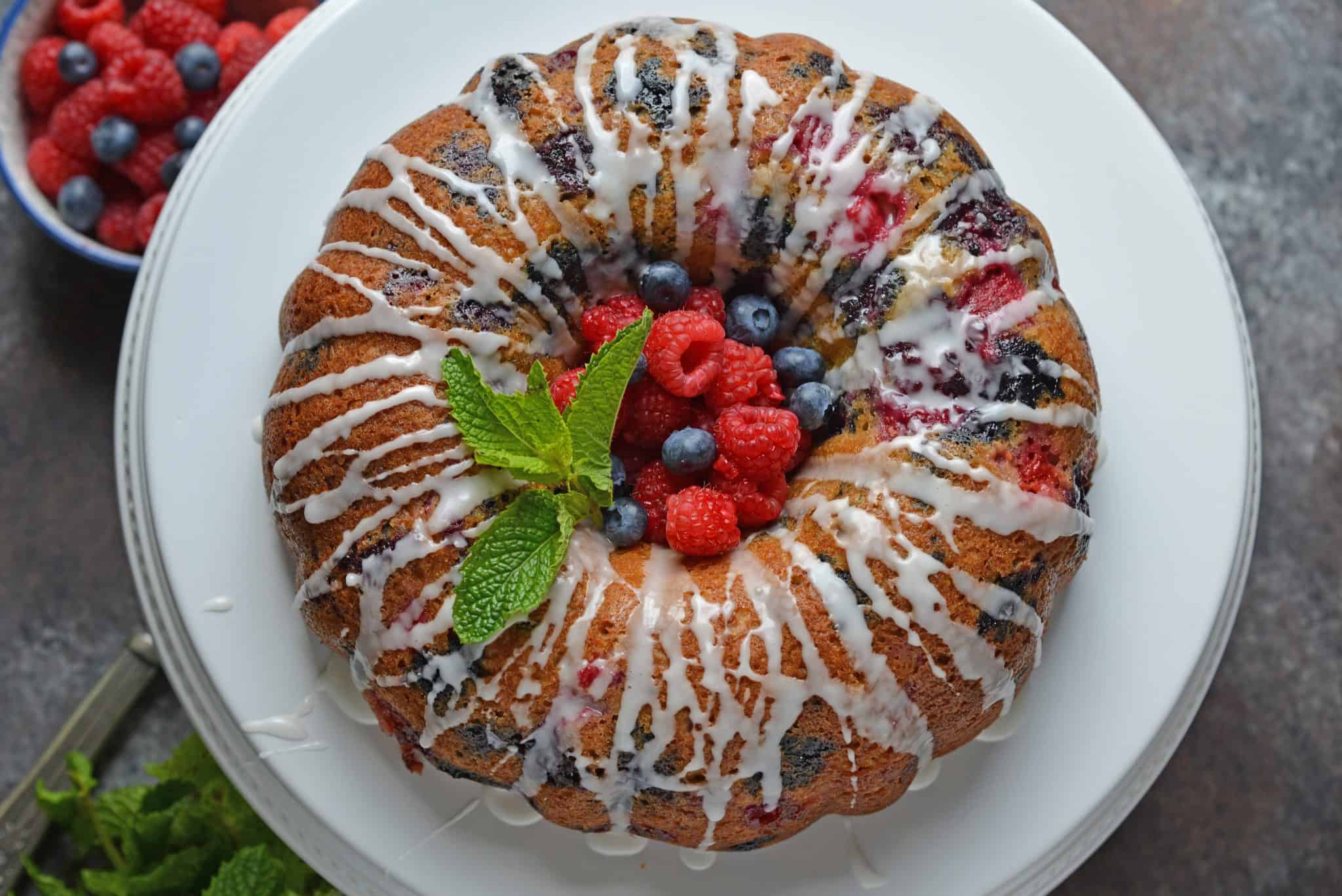 You will be making this Berry Buttermilk Pound Cake all year long! Fresh or frozen berries, this buttermilk cake is delicious and perfect for dessert or brunch. #buttermilkcake #buttermilkpoundcake www.savoryexperiments.com