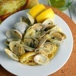 Clam Sauce Recipe- just like at the restaurant, plus see me super easy tips for cleaning clams for any recipe! Buttery broth, chopped and whole clams in an easy shallot, garlic and parsley sauce. Ready in just 40 minutes! www.savoryexperiments.com