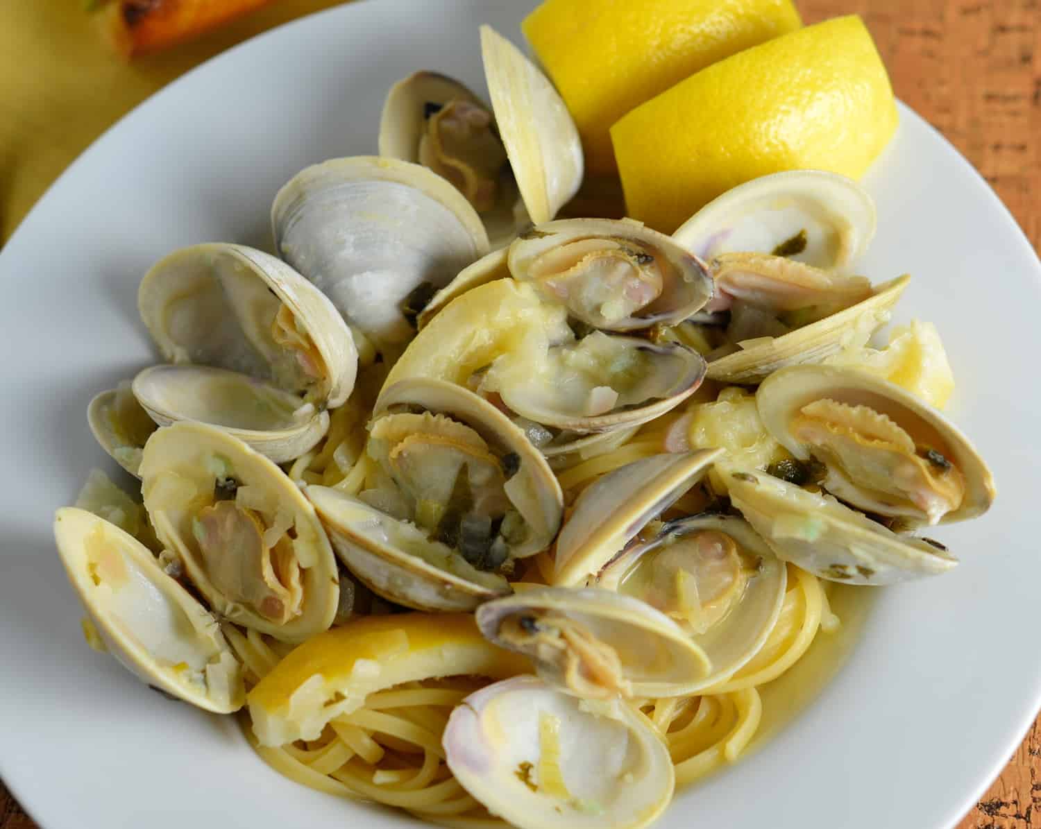 Linguine with White Clam Sauce, just like at the restaurant. Buttery broth, chopped and whole clams in an easy shallot, garlic and parsley sauce. #seafoodpastarecipe #easyseafoodrecipes www.savoryexperiments.com 