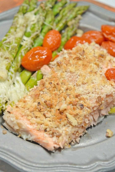 Sheet Pan Crispy Salmon is a fast, easy and healthy weeknight meal. Prep this sheet pan meal in just 5 minutes using tomatoes, asparagus and a crispy panko and walnut topping for you salmon.