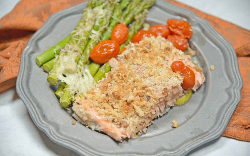 Sheet Pan Crispy Salmon is a fast, easy and healthy weeknight meal. Prep this sheet pan meal in just 5 minutes using tomatoes, asparagus and a crispy panko and walnut topping for you salmon.