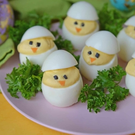 Deviled Egg Chicks take a classic deviled egg recipe and make them into Easter deviled eggs! Perfect as an Easter brunch recipe or appetizer. #deviledeggchicks #easterdeviledeggs www.savoryexperiments.com
