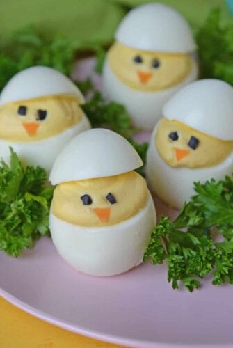 Deviled Egg Chicks take a classic deviled egg recipe and make them into Easter deviled eggs! Perfect as an Easter brunch recipe or appetizer. #deviledeggchicks #easterdeviledeggs www.savoryexperiments.com