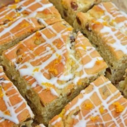 This Irish Soda Bread with Whiskey Glaze recipe is Irish food at its best! It consists of whiskey, caraway seeds, currants, and fresh orange juice and zest! #irishsodabreadrecipe #irishsodabreadhistory www.savoryexperiments.com