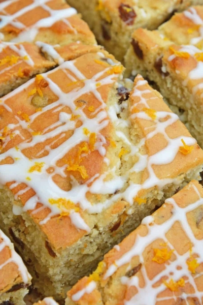 This Irish Soda Bread with Whiskey Glaze recipe is Irish food at its best! It consists of whiskey, caraway seeds, currants, and fresh orange juice and zest! #irishsodabreadrecipe #irishsodabreadhistory www.savoryexperiments.com