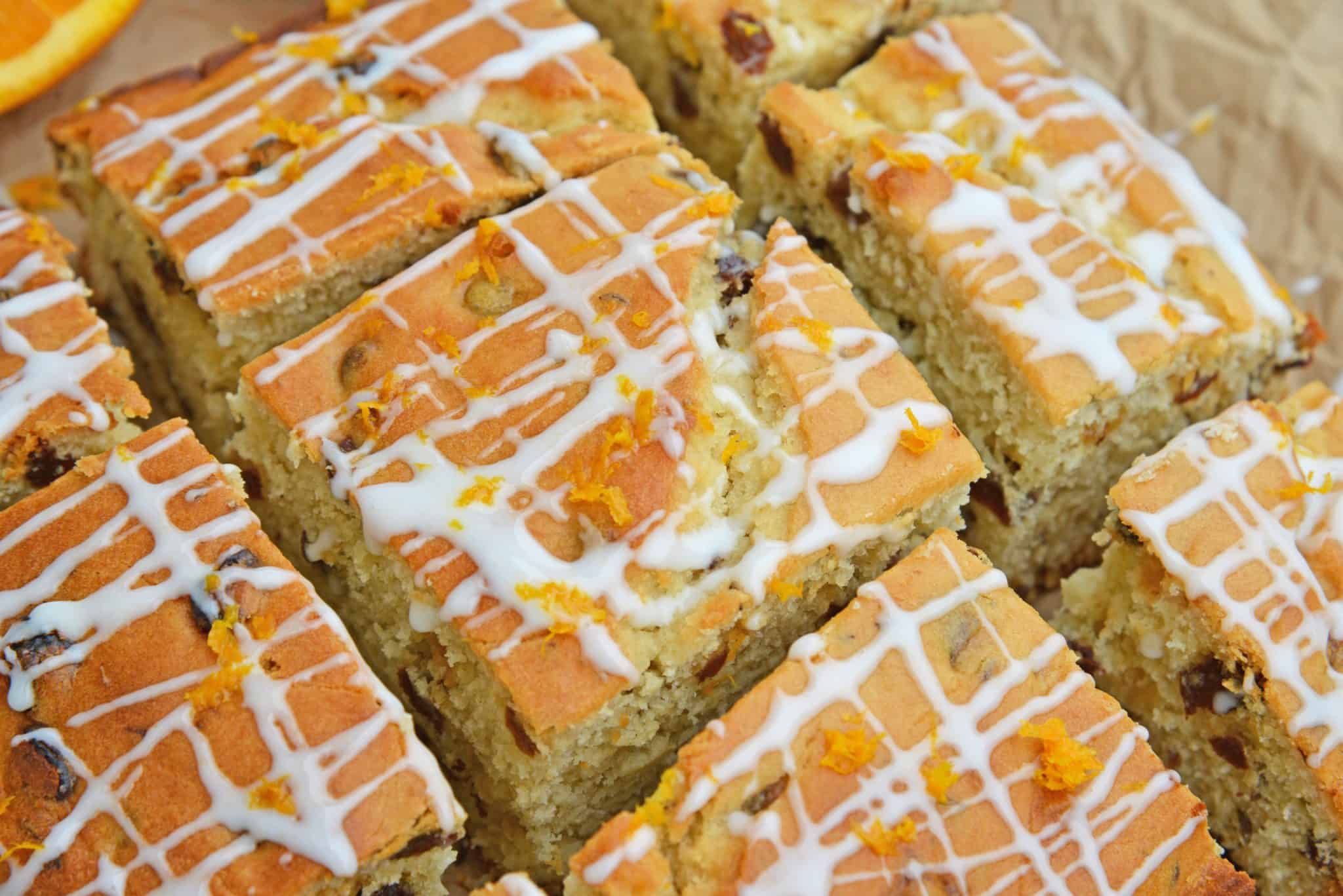 This Irish Soda Bread with Whiskey Glaze recipe is Irish food at its best! It consists of whiskey, caraway seeds, currants, and fresh orange juice and zest! #irishsodabreadrecipe #irishsodabreadhistory www.savoryexperiments.com