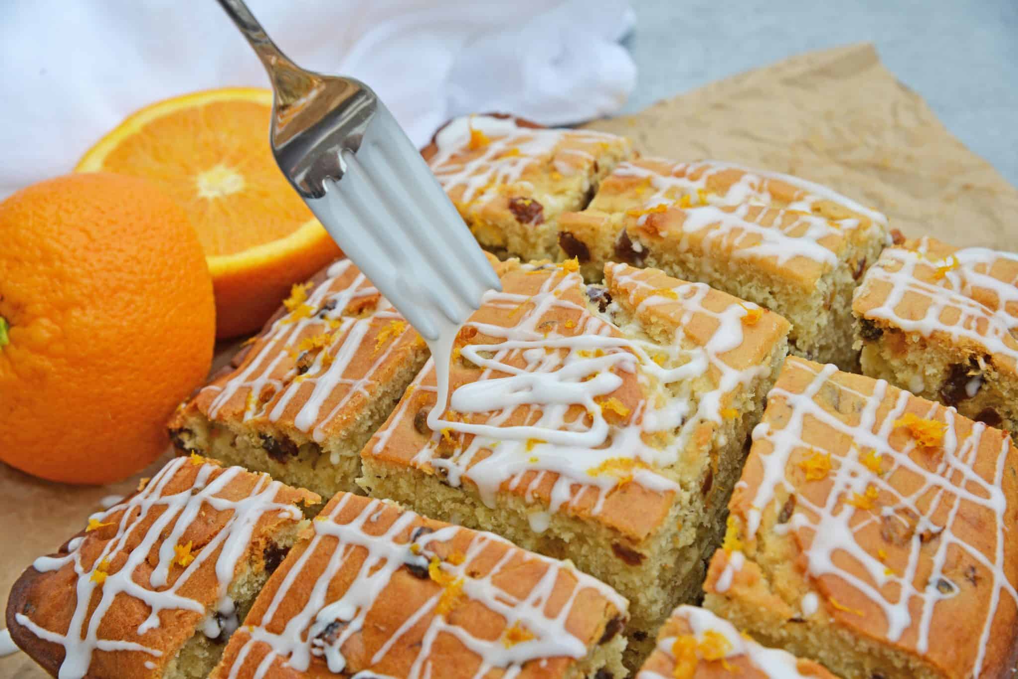 This Irish Soda Bread with Whiskey Glaze recipe is Irish food at its best! It consists of whiskey, caraway seeds, currants, and fresh orange juice and zest! #irishsodabreadrecipe #irishsodabreadhistory www.savoryexperiments.com 