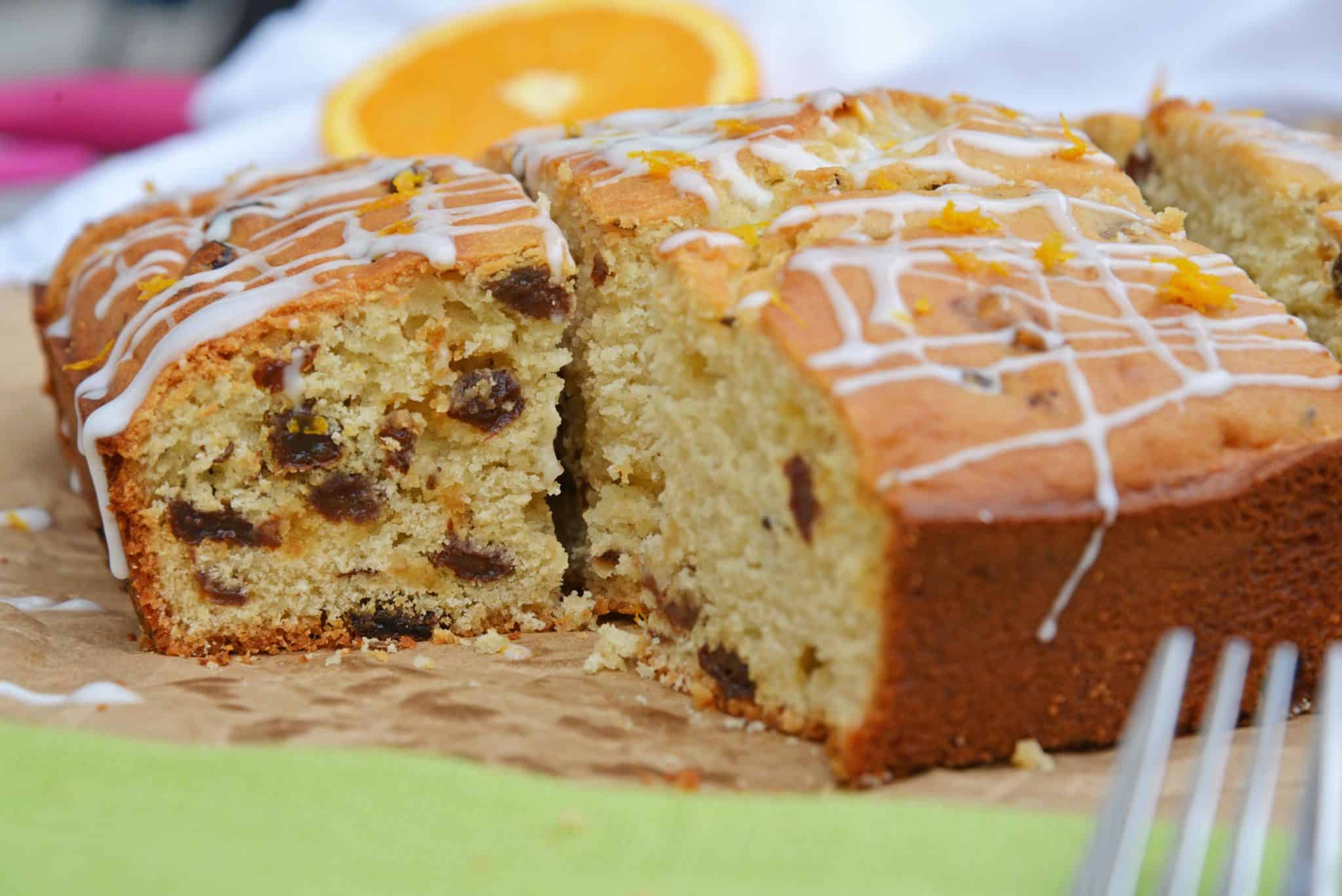 This Irish Soda Bread with Whiskey Glaze recipe is Irish food at its best! It consists of whiskey, caraway seeds, currants, and fresh orange juice and zest! #irishsodabreadrecipe #irishsodabreadhistory www.savoryexperiments.com 