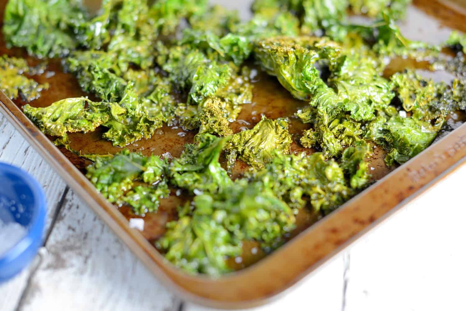 Kale Chips Recipe- olive oil, sea salt and 3 other creative add-ins! A tasty, easy, and healthy alternative to potato chips.
