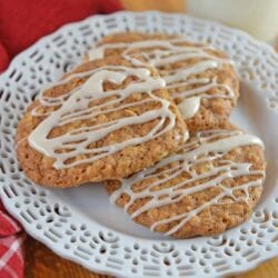 Maple Iced Oatmeal Cookies take your traditional oatmeal cookies and turn them up a notch by adding a delicious maple glaze! #chewyoatmealcookies #softoatmealcookies www.savoryexperiments.com