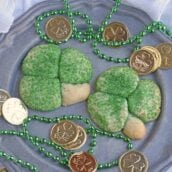 Sugar Cookie Shamrocks bring the luck of the Irish with them. St. Patrick's Day cookies creatively molded to make green lucky clovers, a great St. Patrick's Day dessert recipe. #stpatricksdayfood #stpatricksdaydessert www.savoryexperiments.com