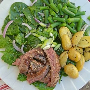 Skirt Steak Salad - an easy and healthy dinner solution that uses 6 ingredients and a simple homemade miso ginger dressing. The only steak salad recipe you need! #steaksaladrecipe #skirtsteaksalad www.savoryexperiments.com