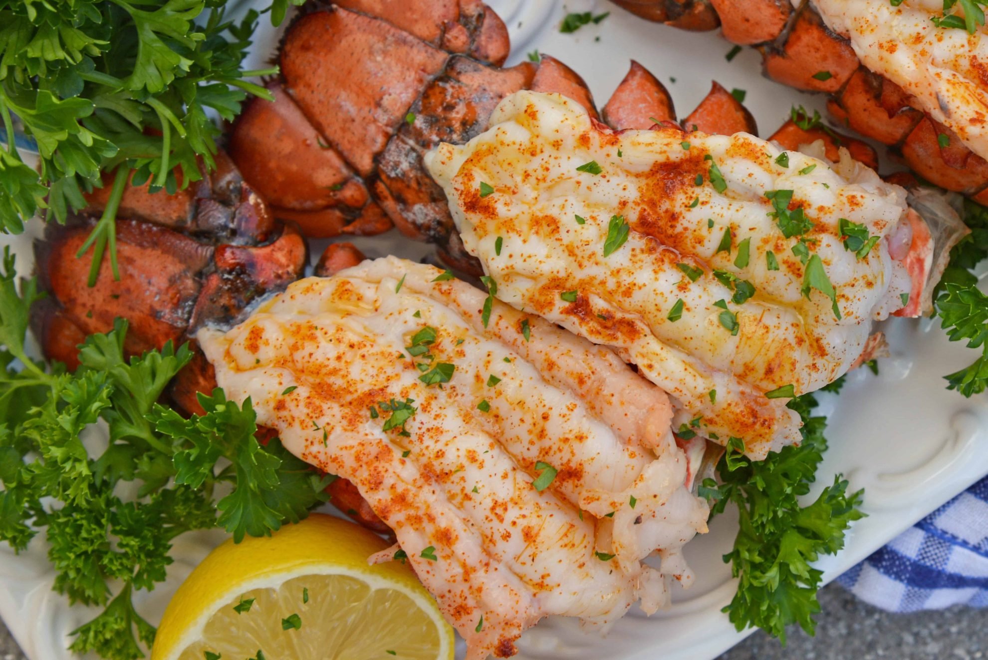 Broiled Lobster Tails with Lemon Butter brings the feel of a fancy restaurant right to the comfort of your own home and is ready in just minutes! #howtocooklobstertails #broiledlobstertails www.savoryexperiments.com